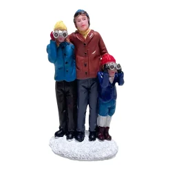 Kerstdorp gezin verrekijker