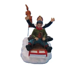Kerstdorp kinderen op slee