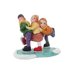 Kerstdorp schaatsende kinderen